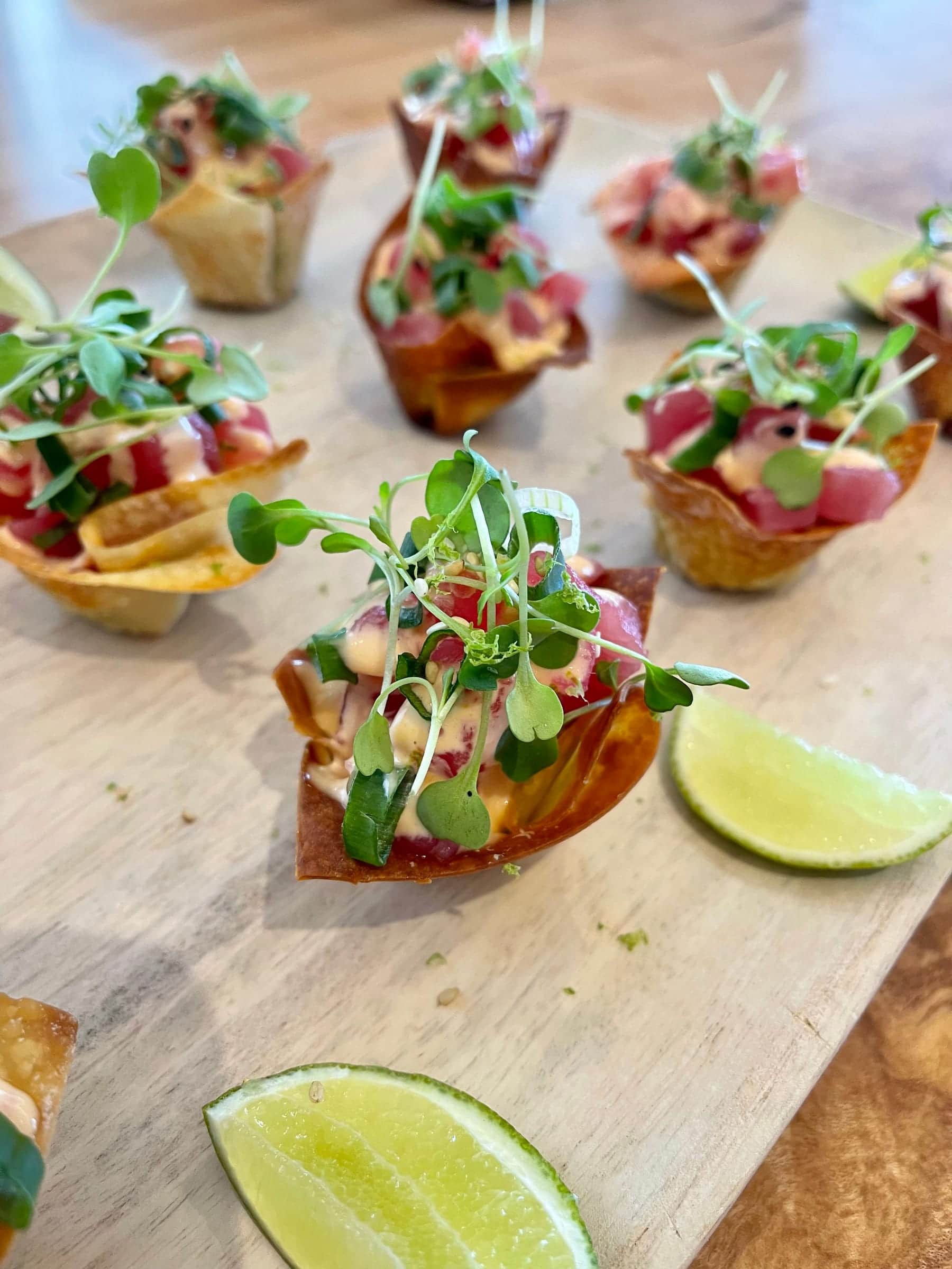Ceviche in crisp wonton cups topped with microgreens