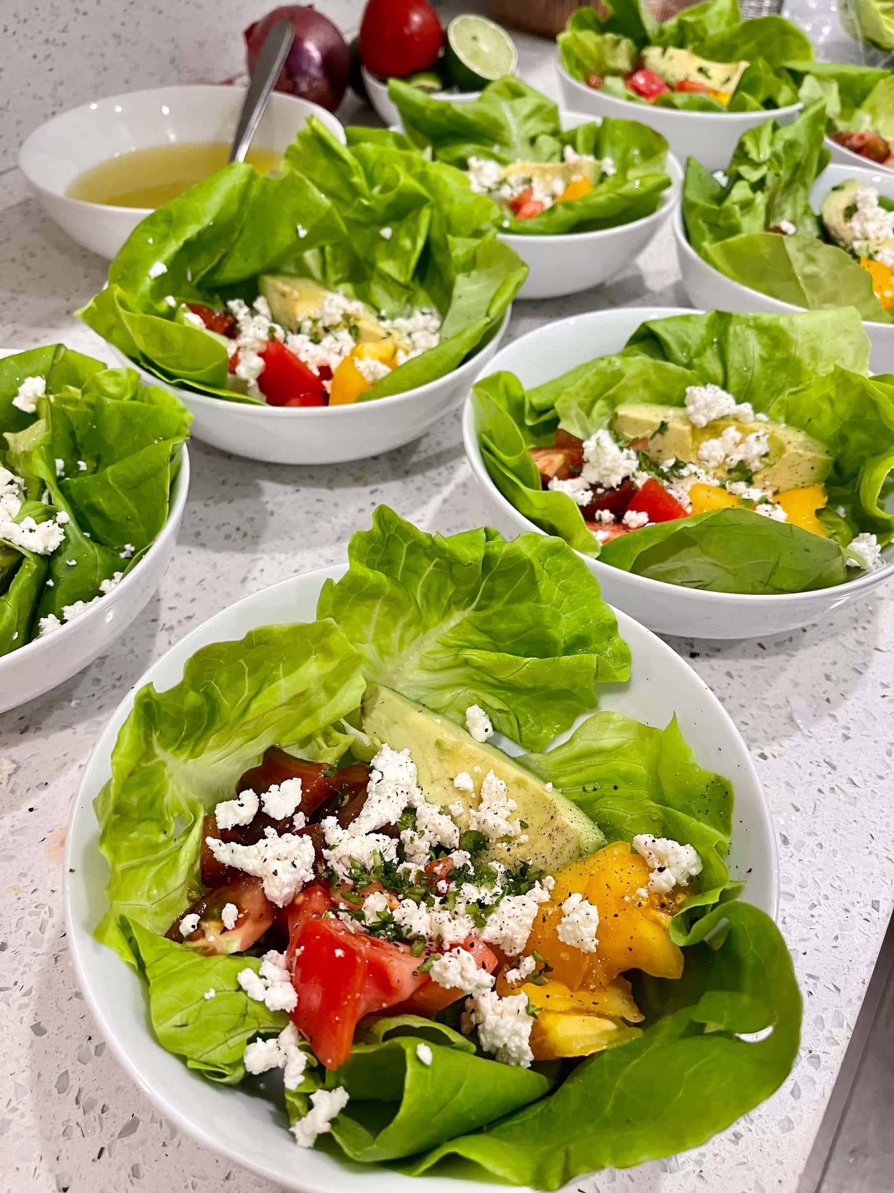 Butter lettuce cups with avocado, tomato, and feta