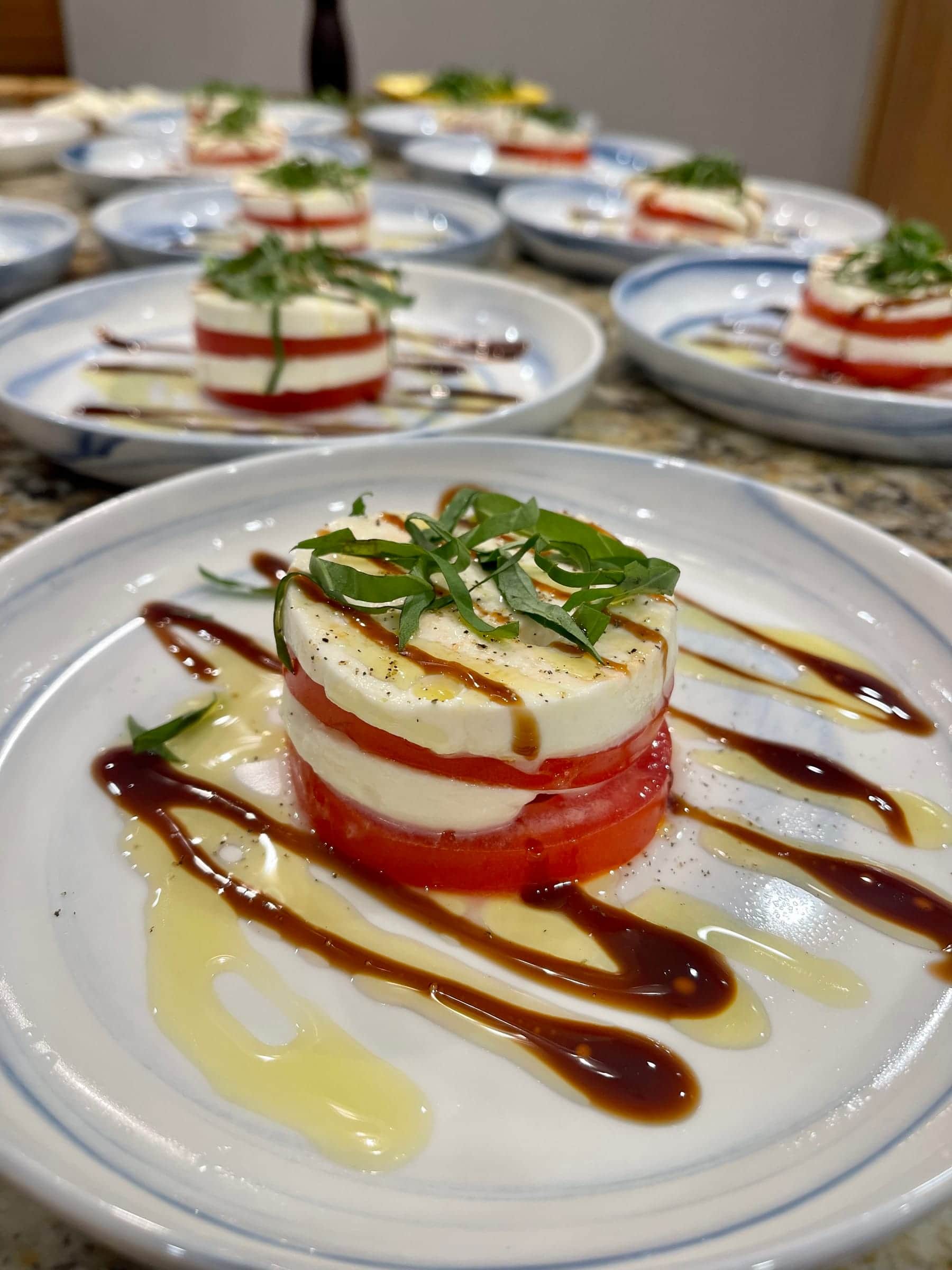 Caprese stack of heirloom tomato, mozzarella, and basil