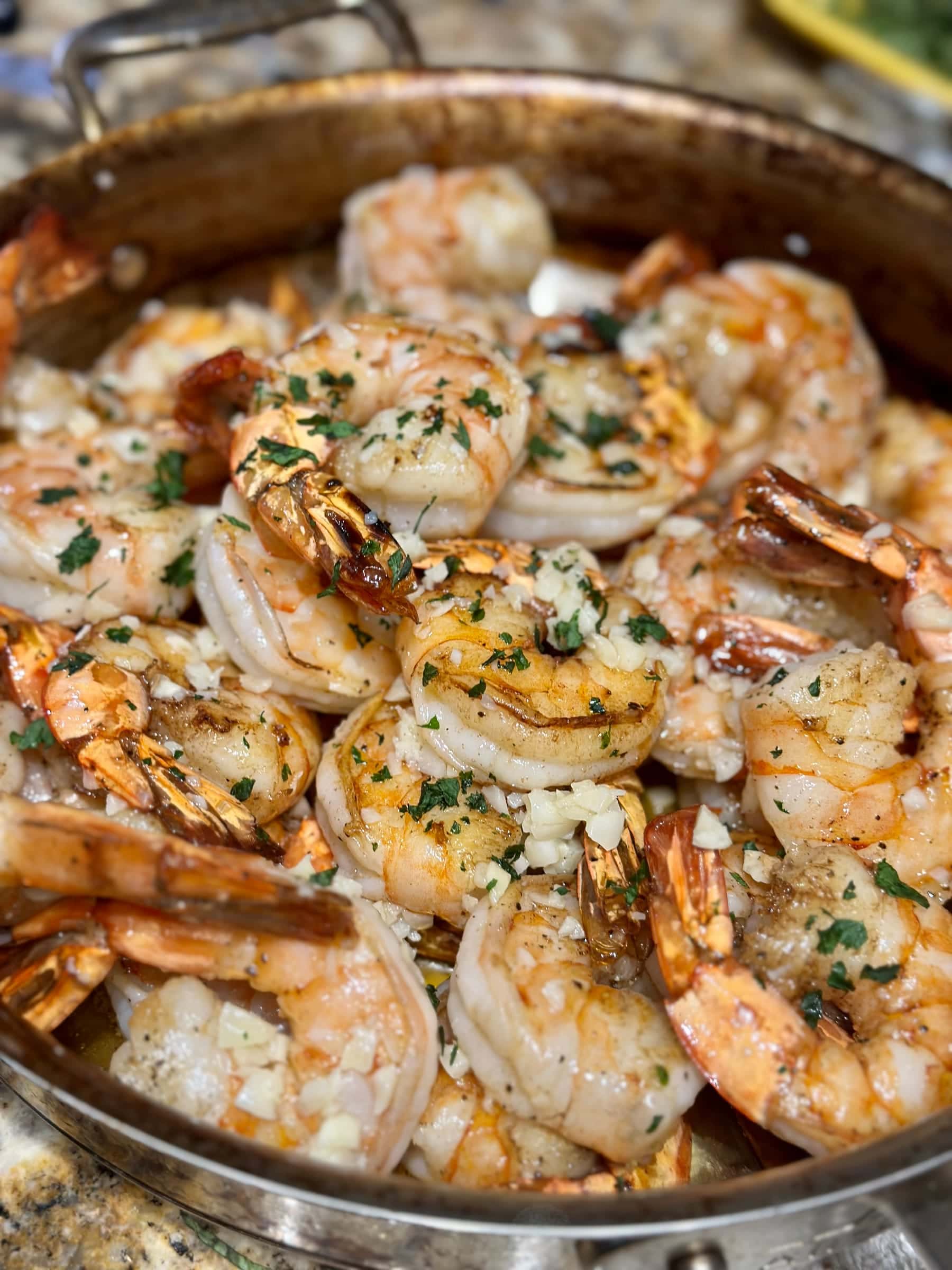 Garlic and herb shrimp piled on a serving tray