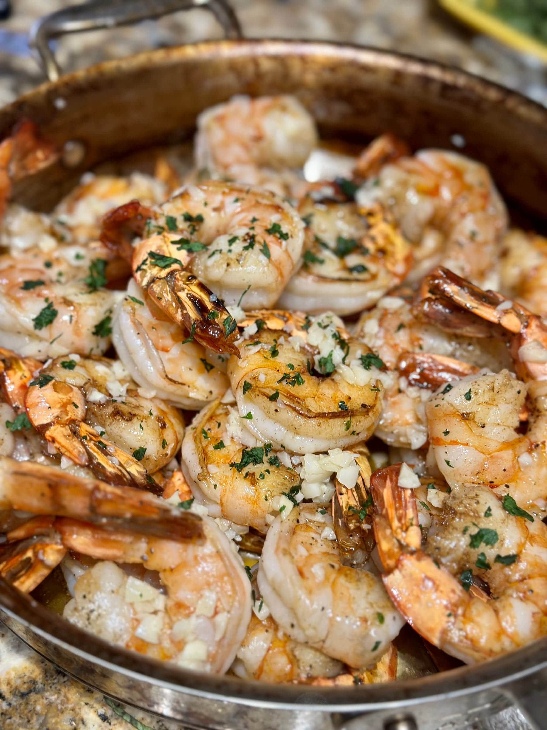 Garlic and herb shrimp piled on a serving tray