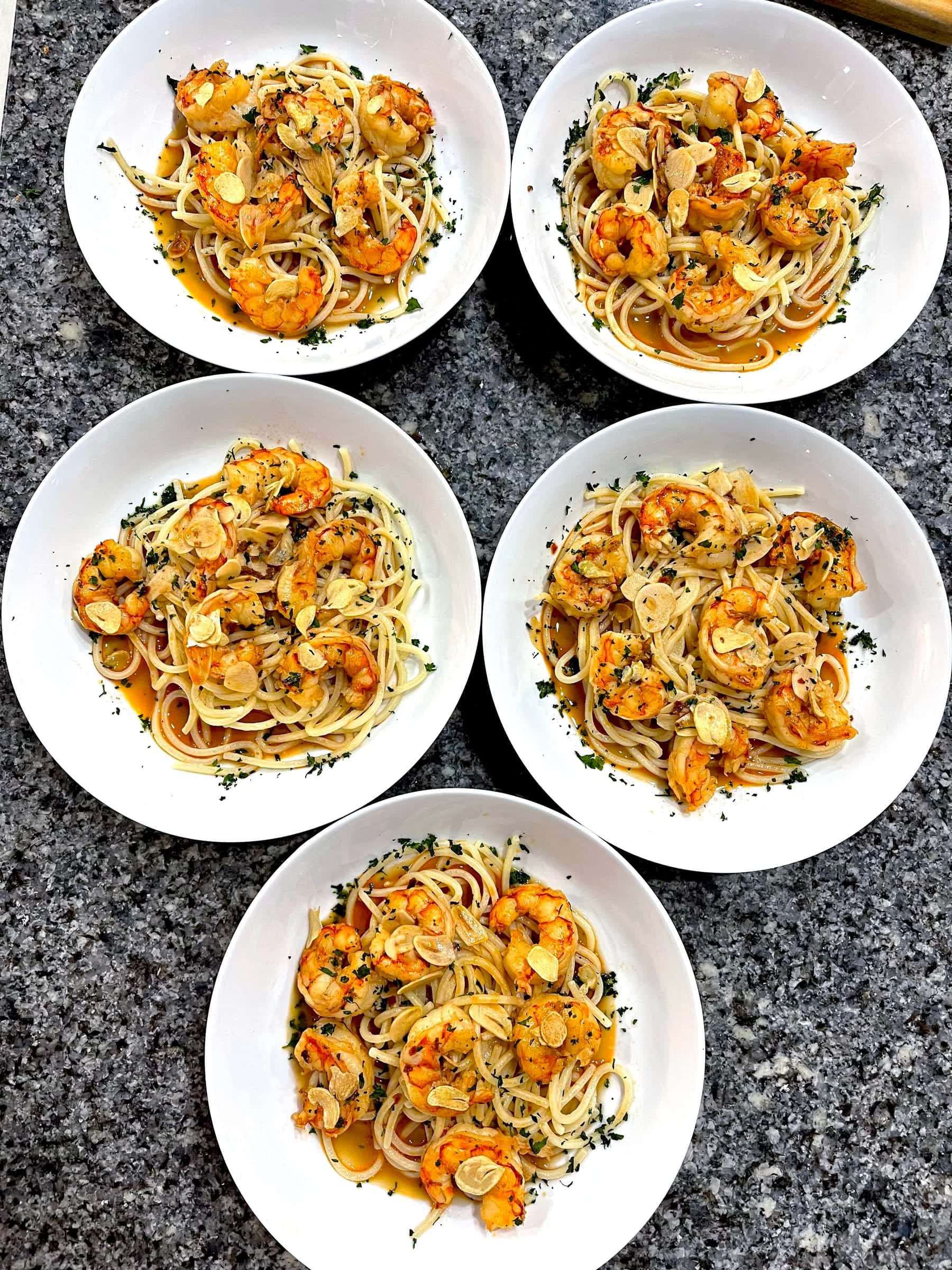 Individually plated shrimp pasta portions