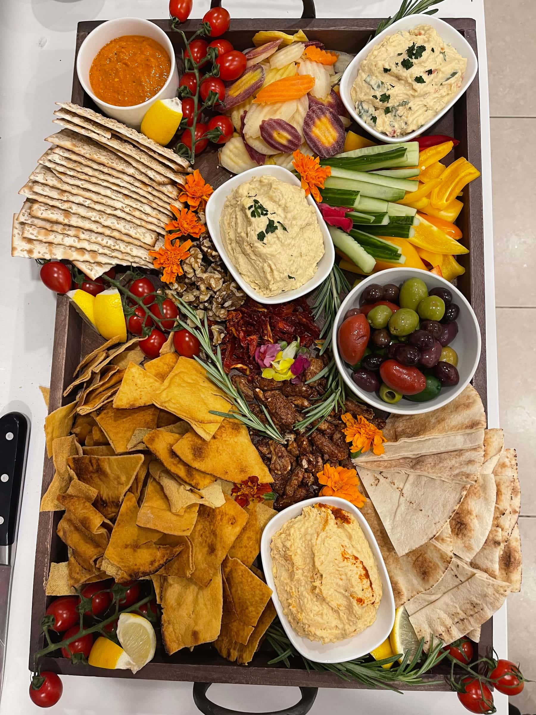 Signature grazing board with dips, crudité, olives, and breads